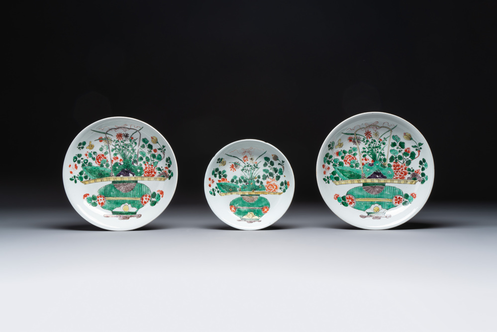 Two Chinese famille verte 'flower basket' dishes and a plate, Kangxi