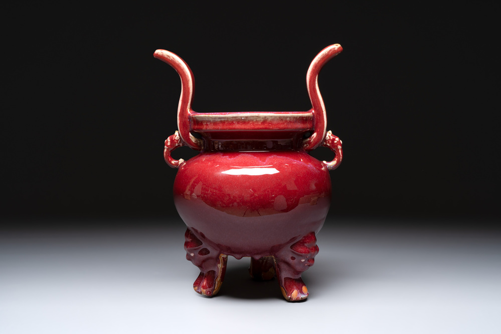 A Chinese flamb&eacute;-glazed tripod censer with 'ruyi' handles, 19th C.