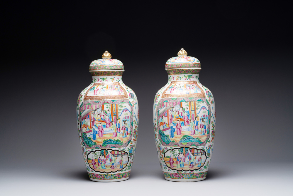 A pair of Chinese Canton famille rose vases and covers with narrative design, 19th C.