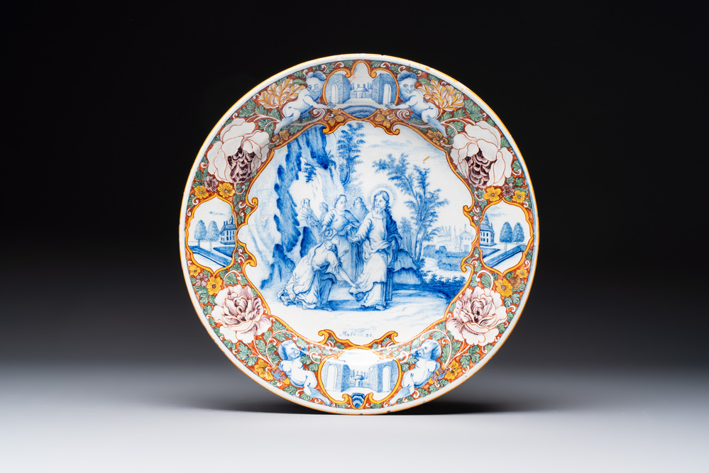 A fine polychrome Dutch Delft mixed technique 'The Faith of the Caanite Woman' plate, 18th C.