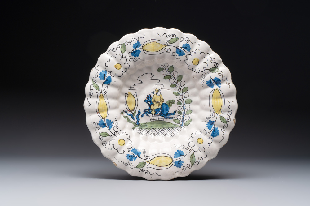 A rare polychrome Dutch Delft 'Chinese horserider' dish, 17th C.