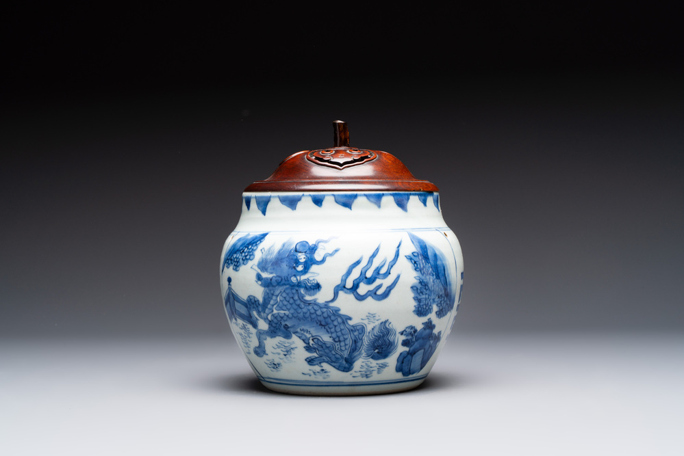 A Chinese blue and white 'qilin' jar and wooden cover, Transitional period