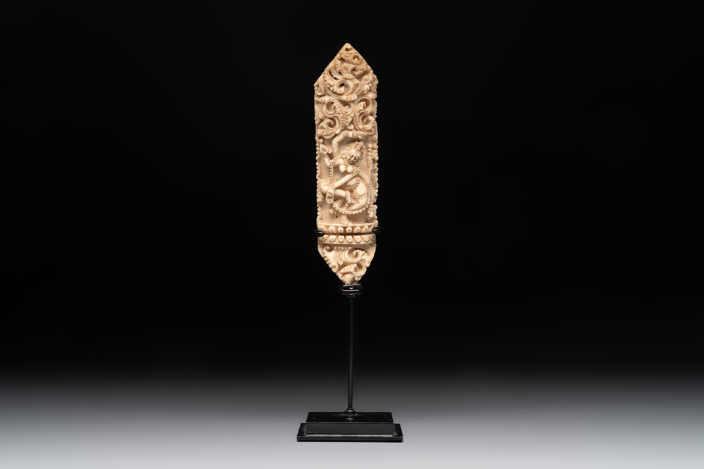 A Tibetan carved bone apron ornament with a dakini, 19th C.