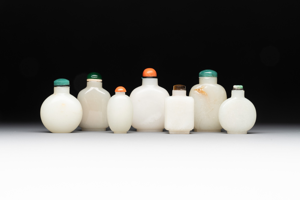 Seven Chinese white and celadon jade snuff bottles, 19th C.