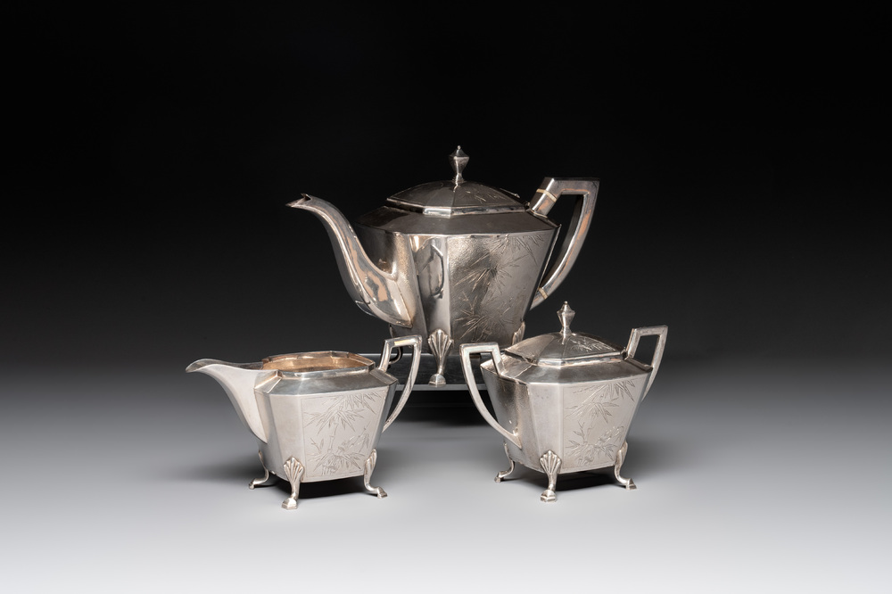 A Chinese silver covered teapot, sugar jar and milk jug with bamboo design, Tackhing 90% silver mark, 20th C.
