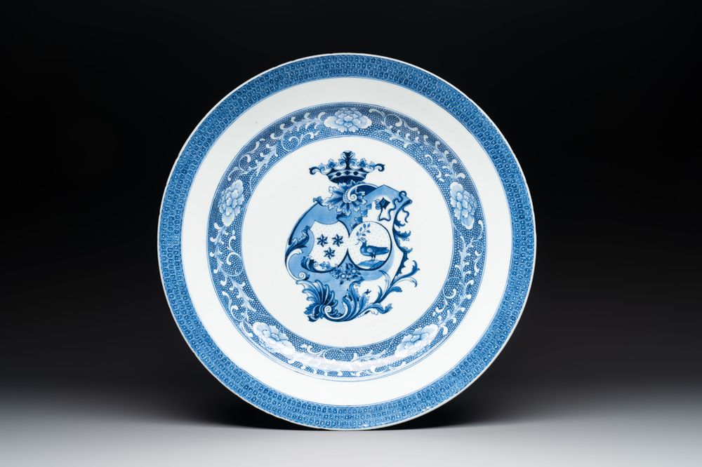 A Chinese blue and white armorial 'Marchant and Gallart accoll&eacute;' dish for the Dutch market, Qianlong