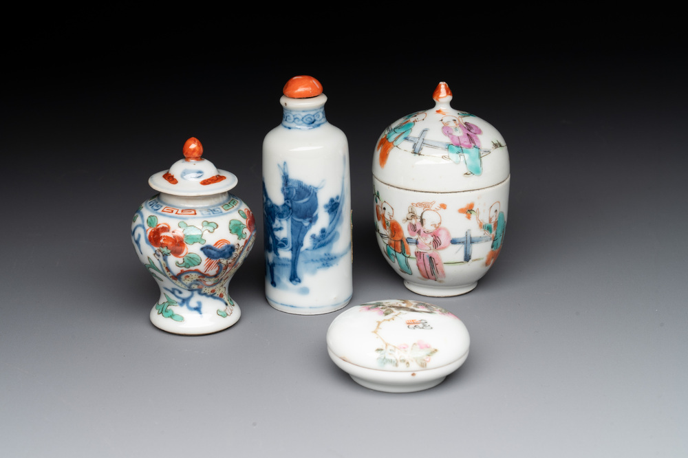 A Chinese famille rose seal paste box and a covered jarlet, a miniature wucai vase and a blue and white snuff bottle, Kangxi mark, 19/20th C.