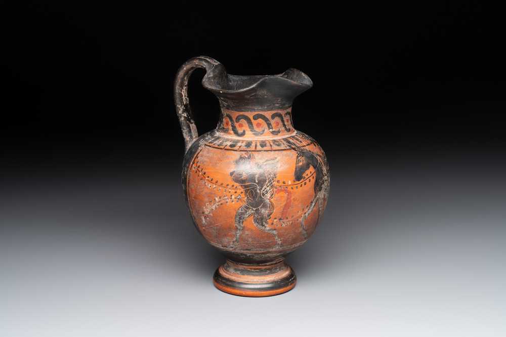 A Greek terracotta 'Oenochoe' vase with Hephaestus and Silenus, Roman era