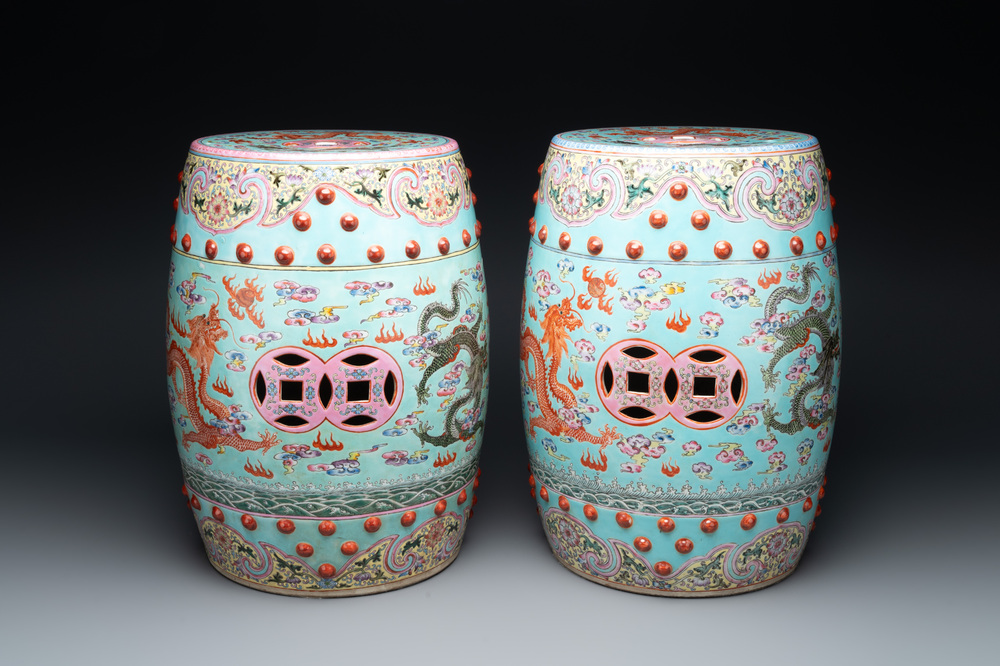 A pair of Chinese famille rose turquoise-ground 'dragon' garden seats, 20th C.