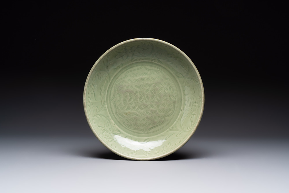 A Chinese Longquan celadon dish with floral design, Ming