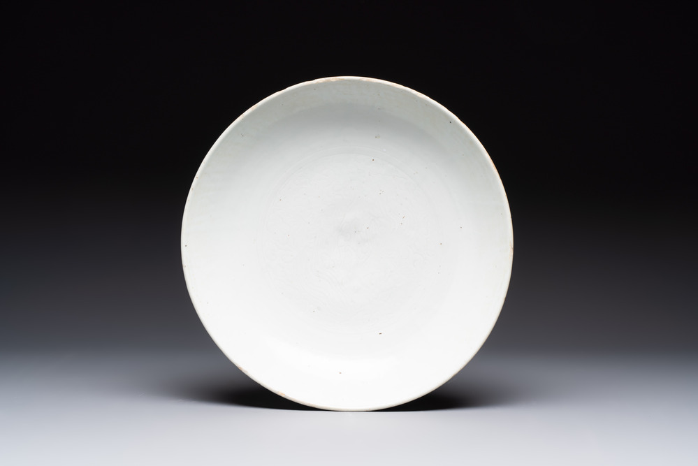 A Chinese white-glazed incised 'double phoenix' dish, Jiajing mark and of the period
