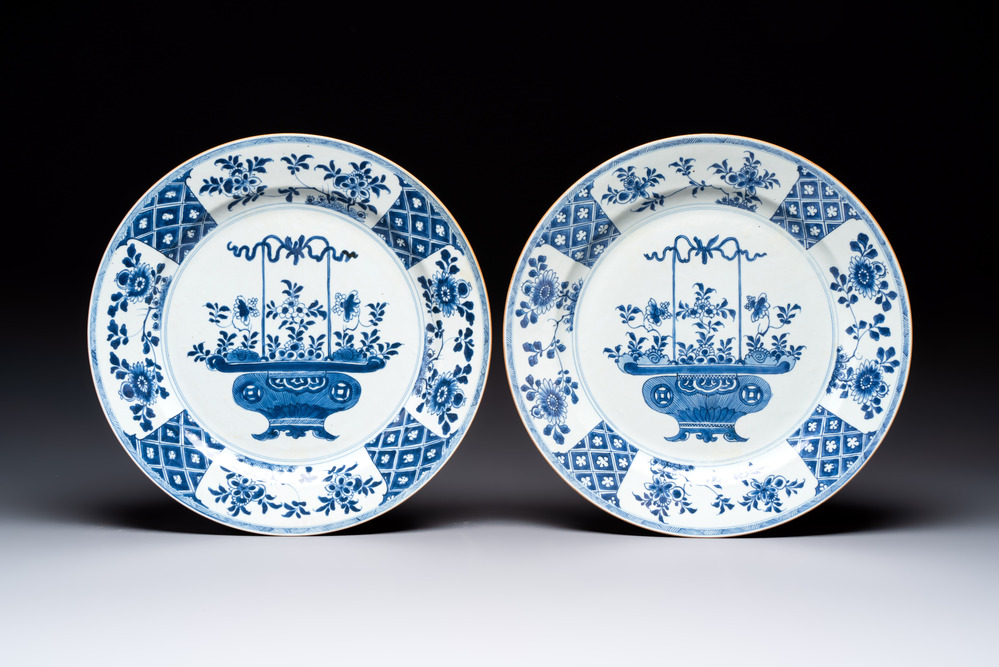 A pair of Chinese blue and white 'flower basket' dishes, Yongzheng