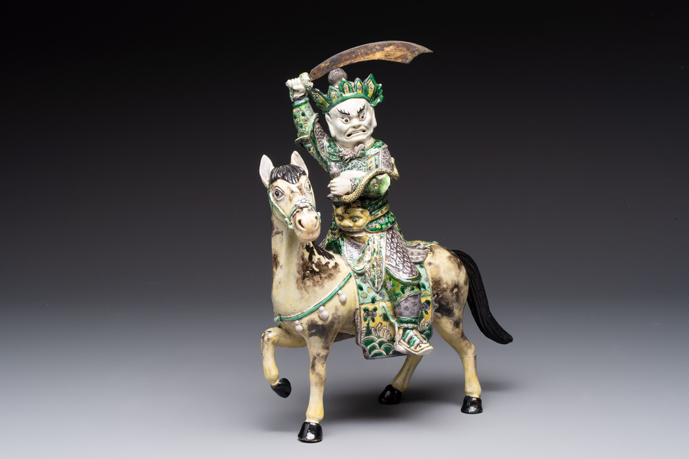 A fine Chinese verte biscuit sculpture of a Heavenly King on horseback, 19th C.