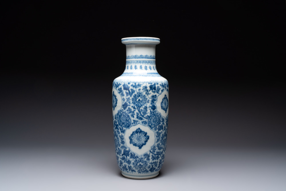 A Chinese blue and white 'flower scrolls' rouleau vase, Kangxi
