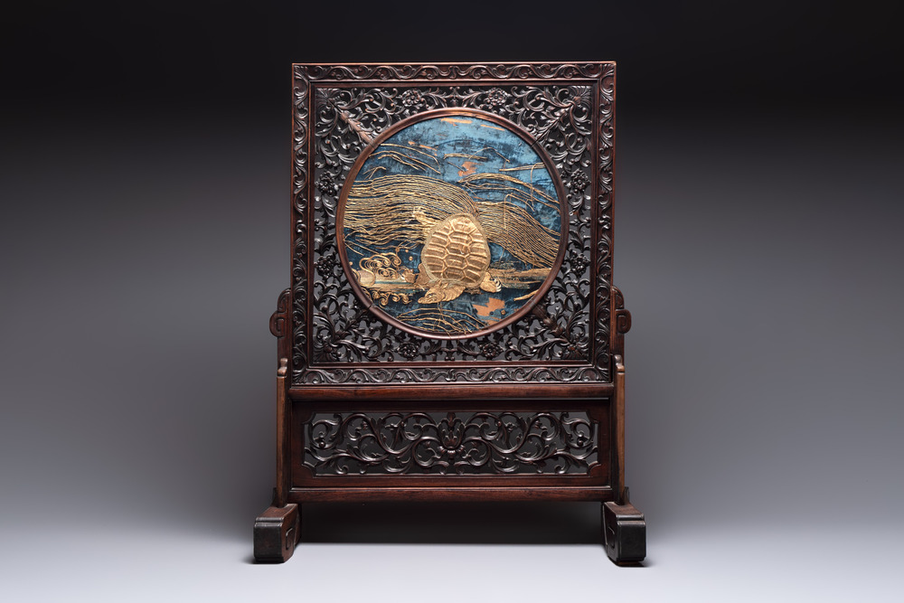 A Chinese wooden table screen with an embroidered silk with turtle design, 19th C.