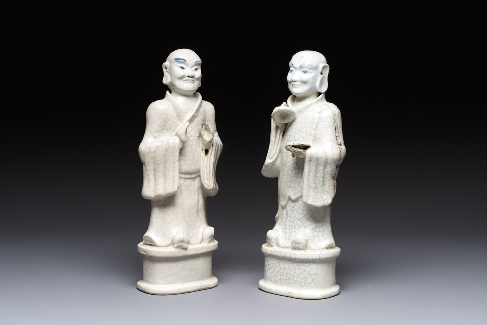 A pair of Chinese blue and white crackle-glazed monks, 19th C.