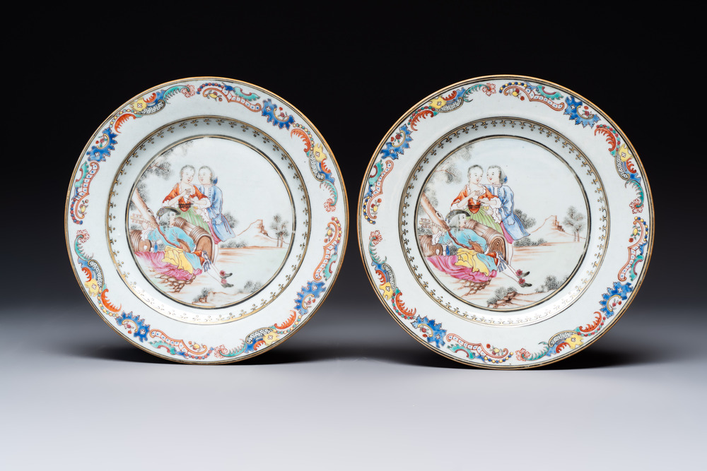 A fine pair of Chinese gilt-decorated famille rose 'Autumn' plates with troubadours, Qianlong