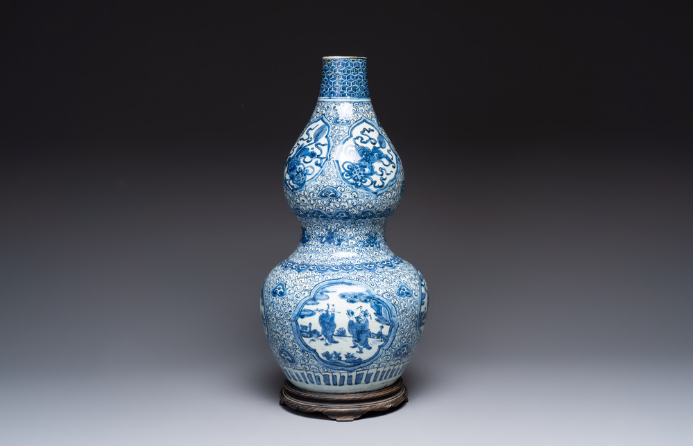 An impressive Chinese blue and white 'Eight Immortals' double gourd vase, Jiajing/Wanli