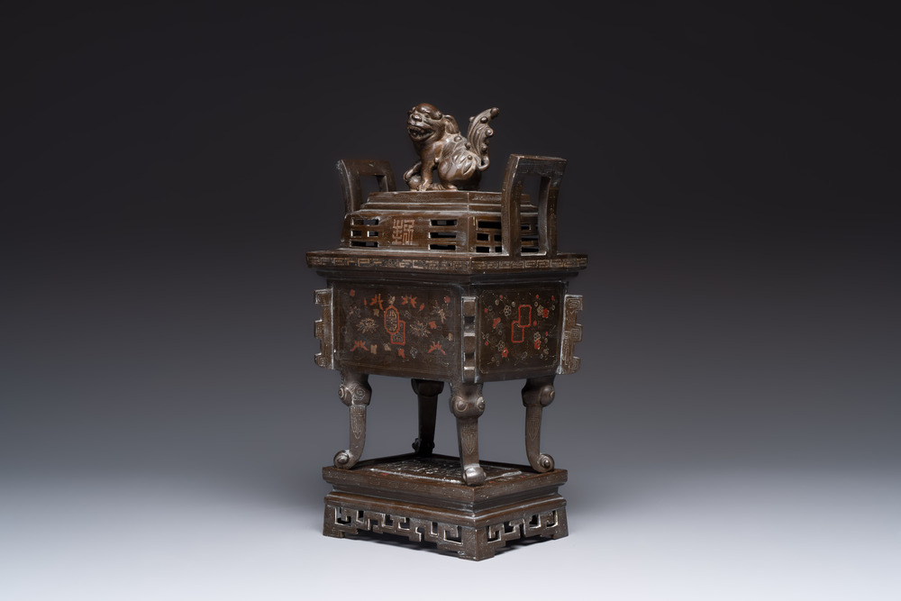 A large Vietnamese copper- and silver-inlaid rectangular 'Buddhist lion' censer and cover on stand, 19th C.