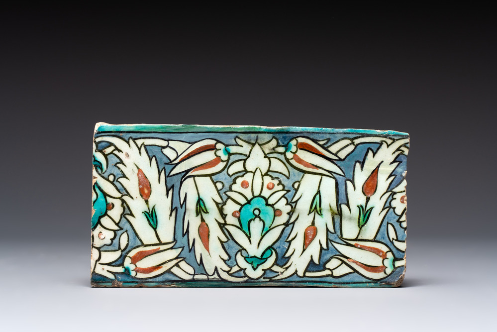 A polychrome Iznik-style Damascus pottery frieze tile with floral design, 17/18th C.