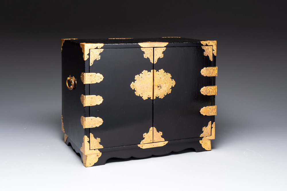 A rare Japanese black-lacquered cabinet with finely engraved gilt mounts, Edo, late 17th C.