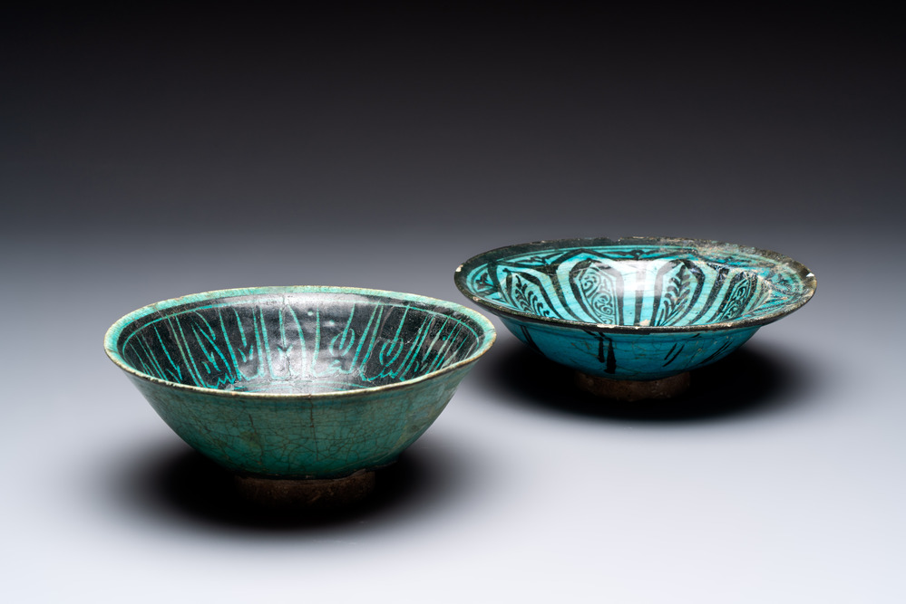 Two turquoise-and-black-glazed bowls, Kashan, 13/14th C.