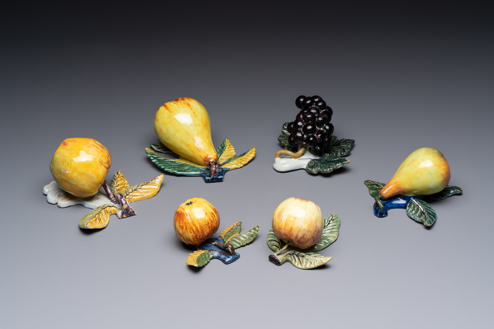 A collection of six polychrome Dutch Delft hanging fruits, 18th C.