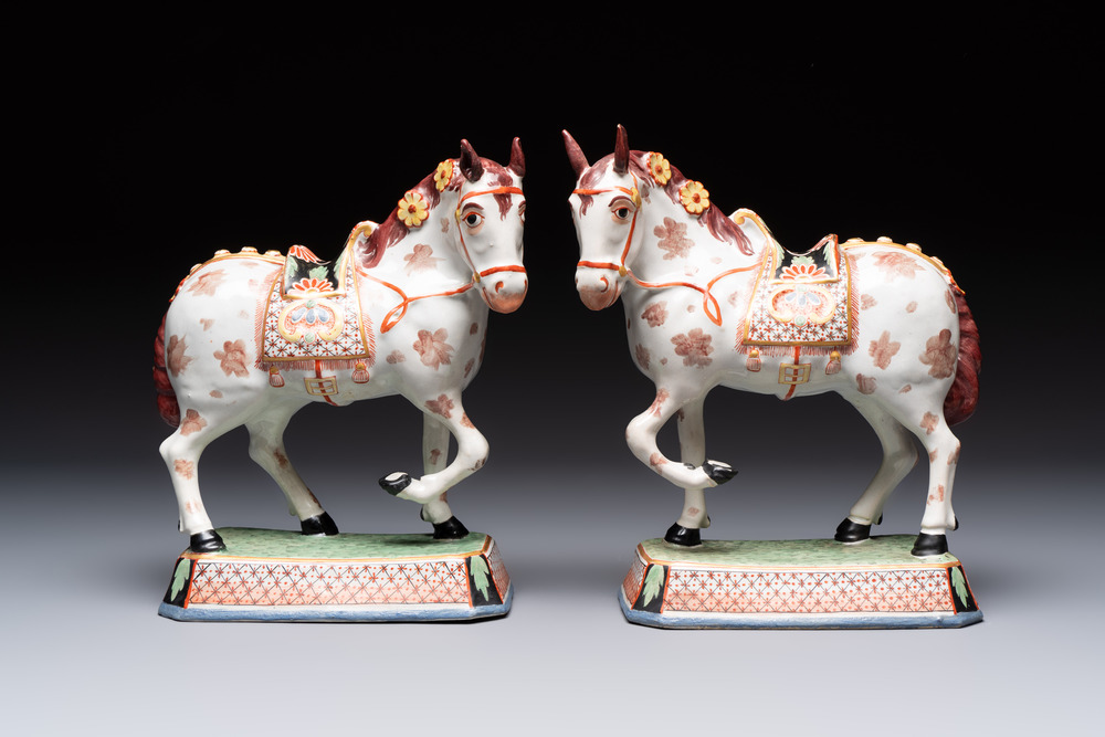 A pair of polychrome and gilt-decorated Dutch Delft petit feu horses, 18th C.