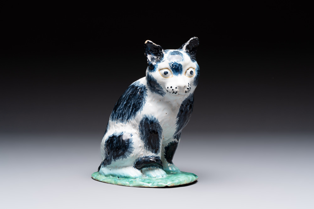 A fine polychrome Brussels faience model of a cat, 18th C.