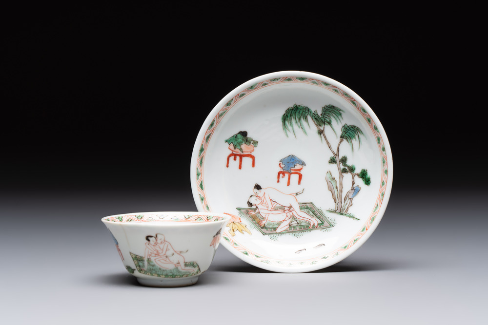 A Chinese famille verte 'erotic' cup and saucer, lingzhi mark, Kangxi