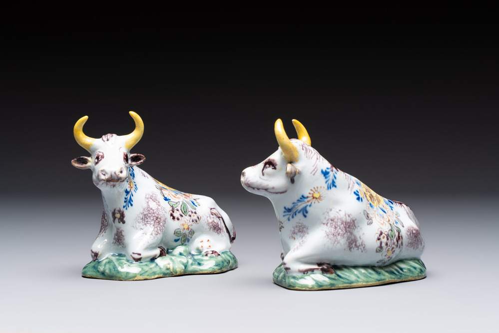 A pair of polychrome Dutch Delft reclining cows, 18th C.