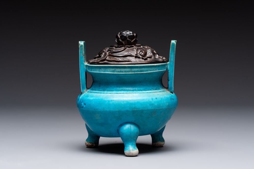 A Chinese turquoise-glazed tripod censer with wooden cover, Ming