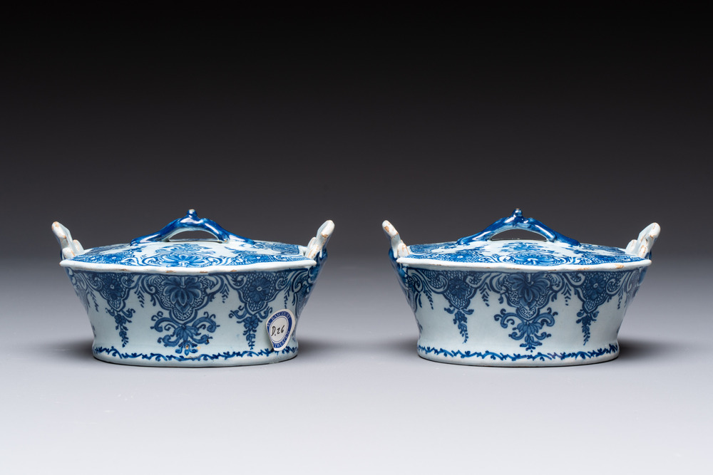 A pair of blue and white Dutch Delft butter tubs and covers, 18th C.