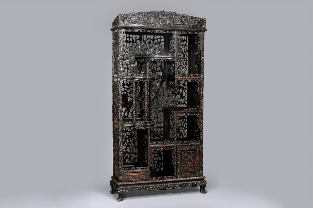 A richly carved Chinese hongmu display cabinet, Canton, 19th C.