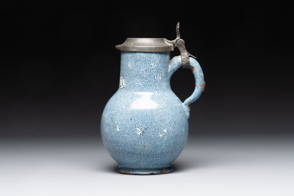 A monochrome blue Brussels faience pewter-mounted jug, 18th C.
