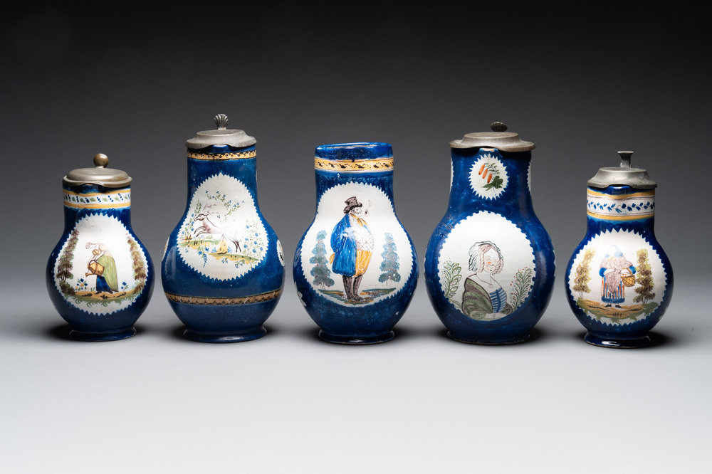 A collection of five polychrome Brussels faience jugs, some with pewter-mounts, 18/19th C.