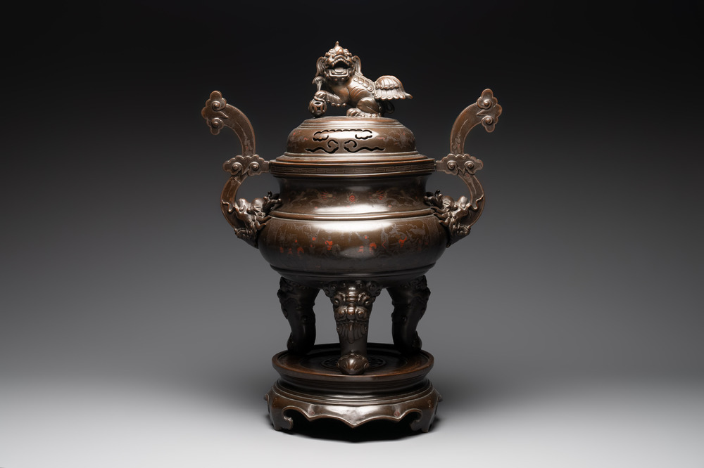 A massive Vietnamese copper- and silver-inlaid 'Buddhist lion' censer and cover on stand, 19th C.