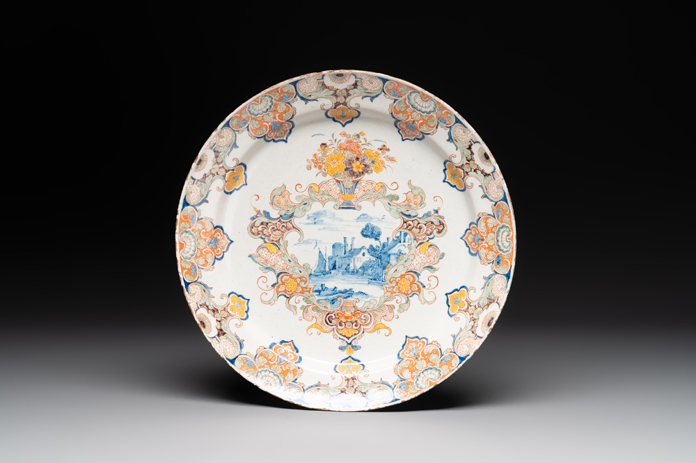 A polychrome Dutch Delft mixed technique dish with a fine landscape, 18th C.