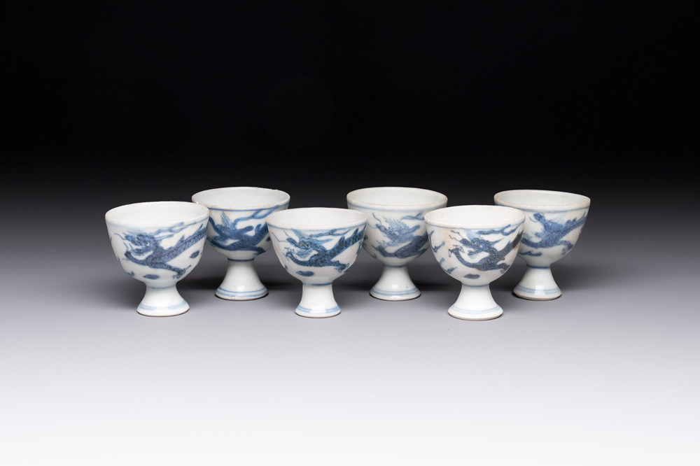 Six Chinese blue and white 'Hatcher cargo' stem cups with dragons, Transitional period