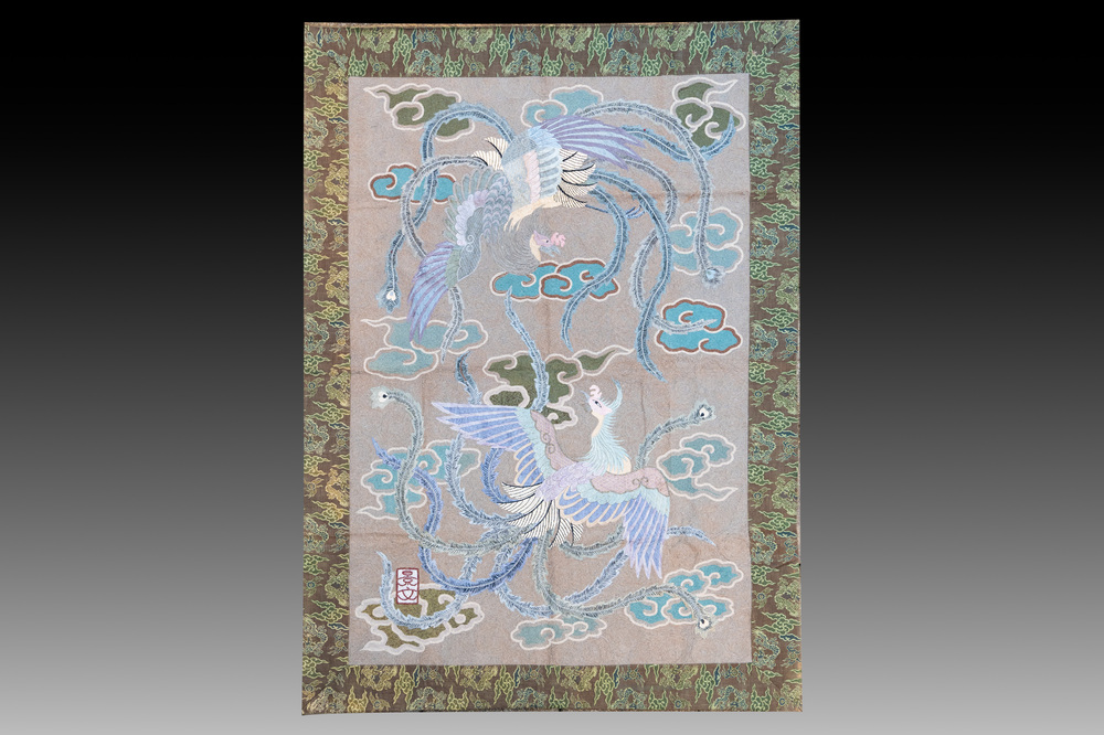 A Japanese embroidered wool and silk wall tapestry with two phoenixes, Meiji, 19th C.