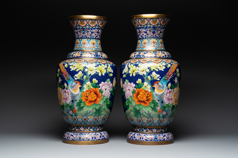 A pair of large Chinese cloisonn&eacute; vases with birds among flowering branches, 20th C.
