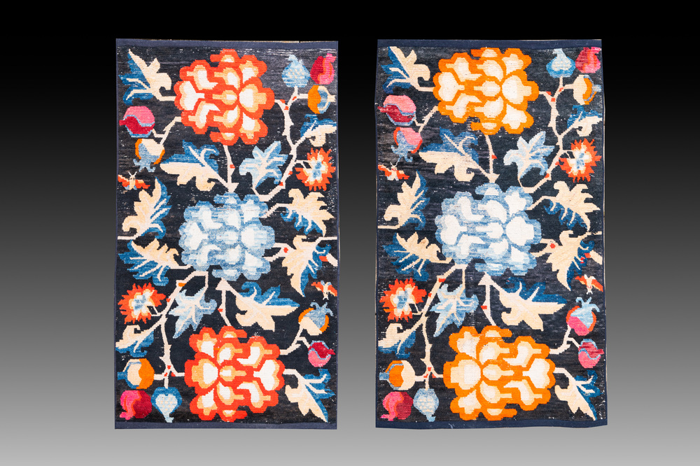 A pair of Tibetan woollen rugs with floral design, 19th C.