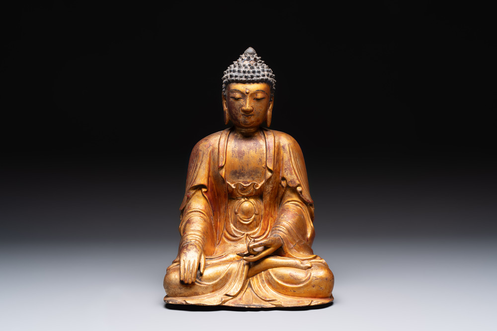 A Chinese gilt-lacquered wooden sculpture of Buddha, Ming