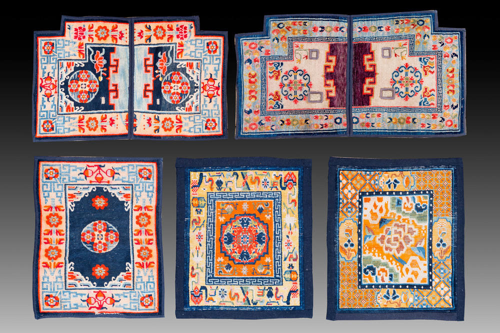 Two Tibetan saddle rugs and three small rugs, 19th C.