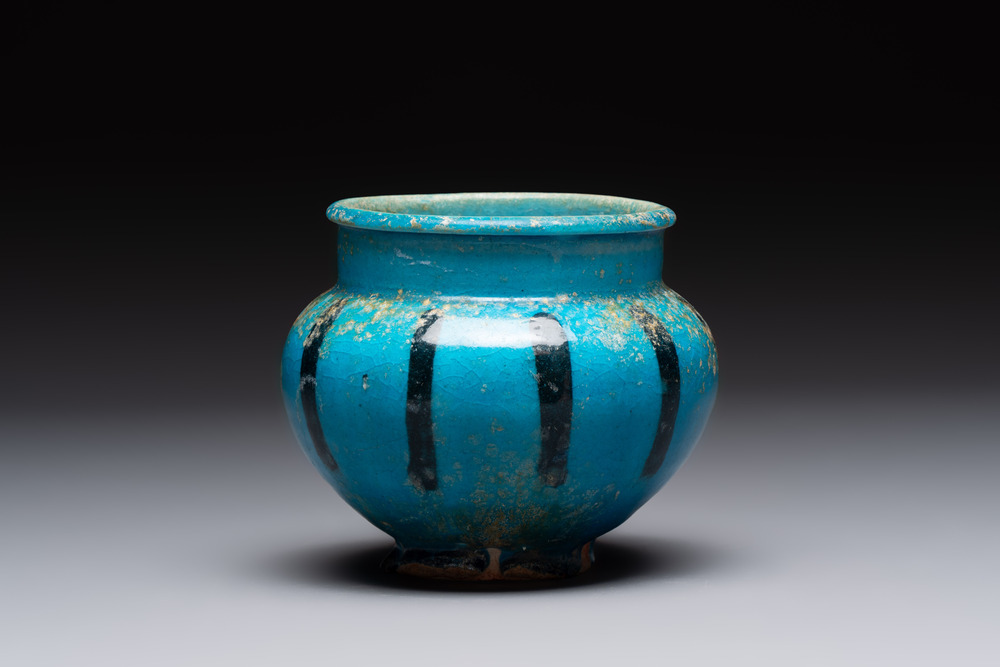 A fine Raqqa turquoise-glazed striped jar, Syria, 13th C.