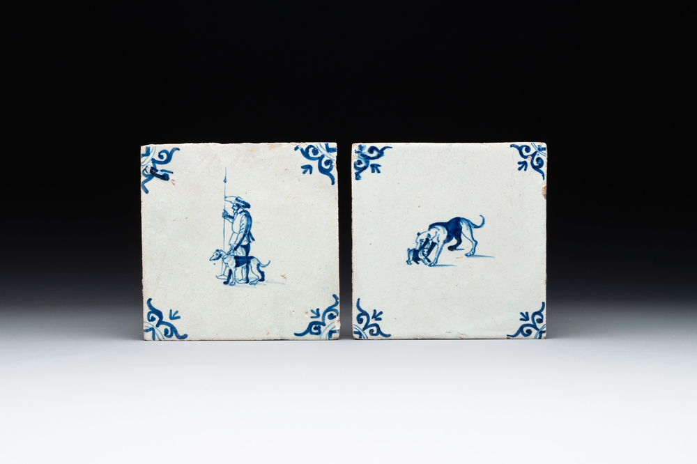 Two blue and white Dutch Delft 'shepherd and dog' and 'dog with puppy' tiles, 17th C.
