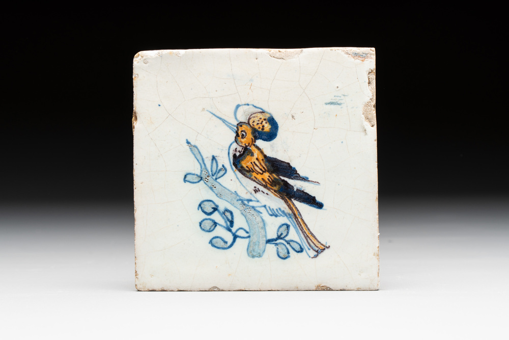 A polychrome Dutch Delft 'bird on a branch' tile, 17th C.