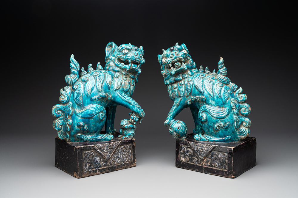 A pair of Chinese turquoise-and-aubergine-glazed Buddhist lions, probably Swatow kilns, 19th C.