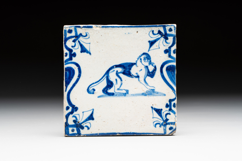 A blue and white Dutch Delft 'monkey with human face' 'candelabra' tile, 17th C.