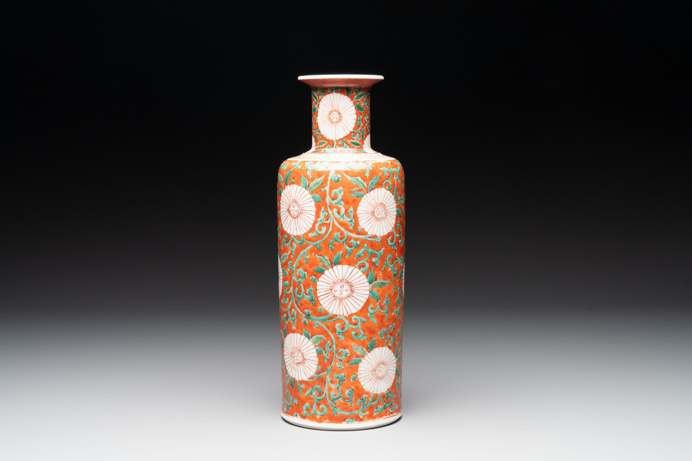 A Chinese famille verte coral-red-ground rouleau vase with flower scrolls, Kangxi